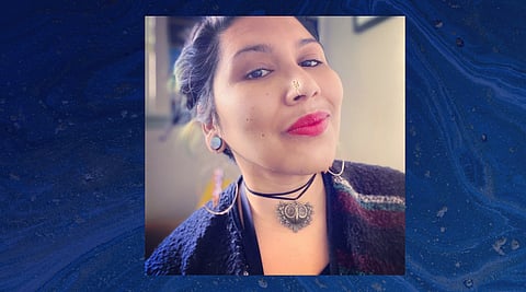 Afro-Salvadorea poet Clara Olivo recently debuted her new book of poetry, "The Whisper, The Storm and The Light In Between." (Photo: Clara Olivo)