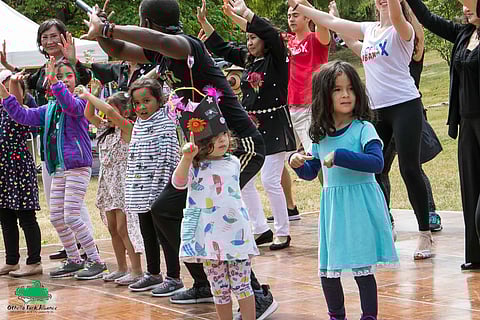 Children dance along with instructors from La Clave Cubana salsa club, who taught dance moves to the crowd at the 2019 Othello Park International Festival. Photo courtesy of Othello Park Alliance.