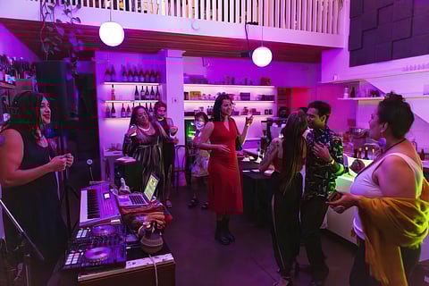 Indigenize Productions creates spaces for healing, joy, and connection that centers queer and trans Native and BIPOC people. Pictured: a crowd dancing at Boujee Natives at Union Coffee and Wine in June. (Photo: Indigenize Productions)