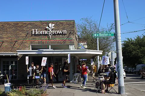 Homegrown workers picket outside the Queen Anne store on Aug. 25 to demand better working conditions and gender pay equity. (Photo: Guy Oron)