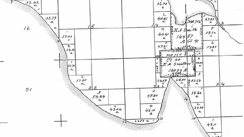 Part of 1863 (United States) Government Land Office map showing what is now Interbay and most of Magnolia in Seattle Washington. Salmon Bay is to the north; Smith Cove juts in from the south. Note the claims by H. A. Smith and E. M. Smither. Smith eventually came to own Smither's claim. The map shows the natural shape of the land before the dredging of a canal to the northeast and the filling of much of the cove to the south. Map is attributed to BOLA Architecture + Planning & Northwest Archaeological Associates, Inc., Port of Seattle North Bay Project DEIS: Historic and Cultural Resources (under the public domain).
