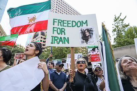 Over 1,000 Iranian Americans and their community allies gathered at Westlake Park in downtown Seattle for a rally and march. (Photo: Alex Garland)