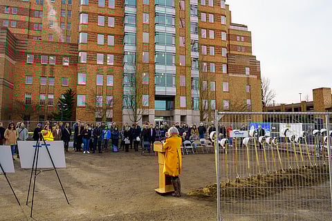 Event attendees watch and listen to Maiko Winkler-Chin, director of Seattle's Office of Housing, as she shares a speech. (Photo: Ronnie Estoque)