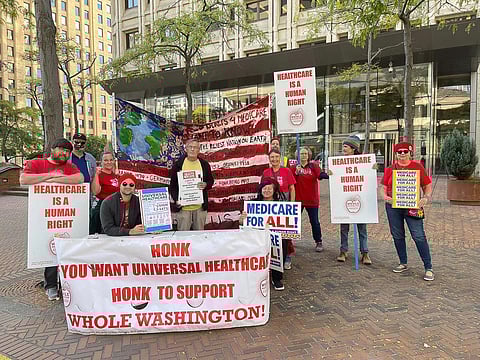 Whole Washington volunteers at the Medicare for All rally in Seattle asking senators to cosponsor S.4204, the Medicare for All Act. (Photo courtesy of Whole Washington.)