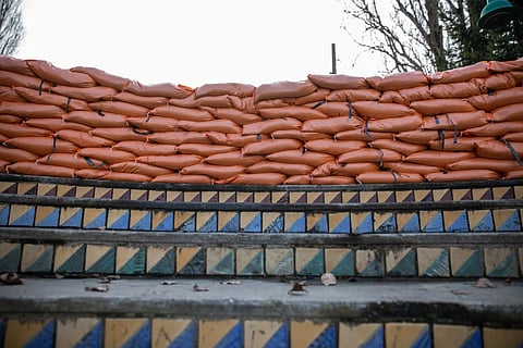 A shot of overlapping sandbags on top of decorative steps in the park