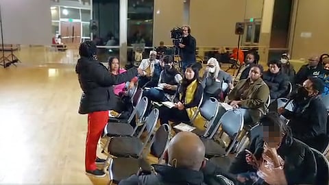 CPC Community Outreach Manager Felicia Cross (far left) instructs a sound operator to cut Castill Hightower's (far right) mic in the middle of her remarks. Screenshot from live video shot by Dr. Howard Gale, used with permission.