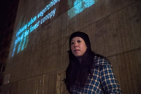 Poet Shin Yu Pai in front of her video poem projection "heyday" at the 2017 Redmond Lights Festival. Pai has recently been named Seattle's fourth Civic Poet. (Photo: James McDaniel/City of Redmond)