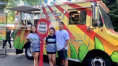 Despite having to close Beacon Hill's Kusiina Filipina in 2017 due to rising rent costs, the Paraiso family never stopped cooking authentic Filipino classics, whether at their restaurants in Federal Way, Tacoma, or via Trixia's CheBogz Food Truck. Pictured: Trixia (left), Paula (middle), and Frayne Paraiso (right). (Photo: Fredrick Avila)
