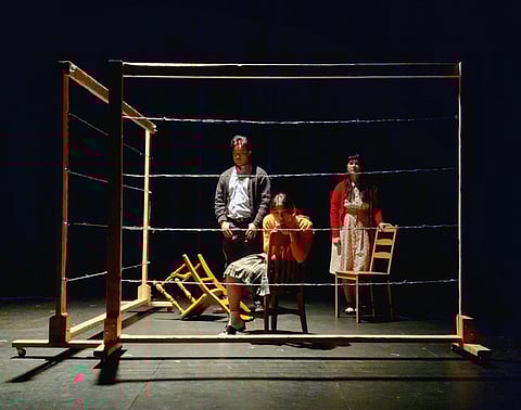 Japanese American characters in a performance of "Friends Across the Wires" are held in horse stalls at the Puyallup Fairgrounds while waiting to be taken to camp after being forcibly removed from Seattle. (Photo: Laurence Wulfe)