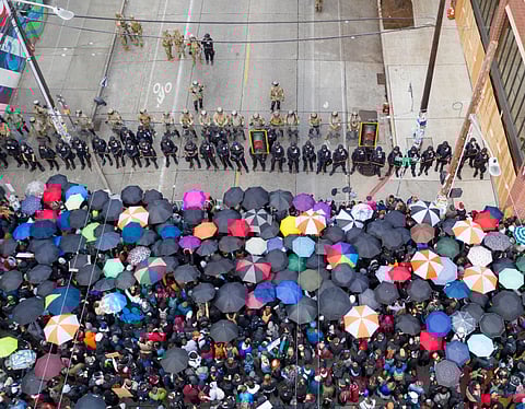 Seattle Police face protestors on Capitol Hill, Seattle, Washington, on June 2, 2020. Photo via Real Window Creative/Shutterstock.com.