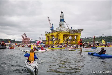 Climate activists in kayaks block Shell's Polar Pioneer arctic drilling rig parked at the Port of Seattle during a 2015 action supported by 350 Seattle. (Photo: Alex Garland)