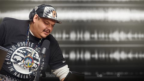 David Hilliare, also known as DJ BIG REZ, in the studio at Daybreak Star Radio. (Photo courtesy of Daybreak Star Radio.)