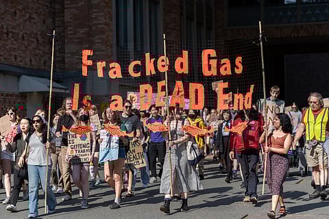 Climate protesters march and chant toward the campus power plant on May 19, 2023. (Photo: Grant Vu)