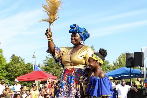 Nansare Consolata, AfroBeats & Kulture stage producer, pictured with her daughter OliviaBarcelos, at Umoja Fest in 2022. (Photo: Mujale Chisebuka of Outside Thinc)