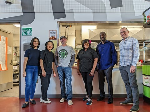 Members from the City of Seattle, the SPS Culinary Services Team, and the Muckleshoot Indian Tribe celebrate their collaboration at the Seattle World School on May 25. From left to right: Gurdeep Gill, Lan Huynh, Louie Ungaro, Elizebeth Winston, Aaron Smith, Chris Iberle. (Photo: Carmen Hom)