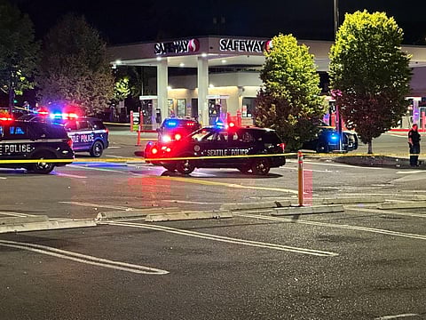 At about 9 p.m. on Friday, July 28, two suspected shooters fired "dozens and dozens" of shots toward the Rainier Beach Safeway parking lot wounding five people. (Photo: Phil Manzano)