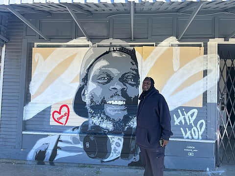 Charles, Seattle hip-hop's most devoted fan, stands in front of a new mural in his honor in Beacon Hill. (Photo: Perry Porter)