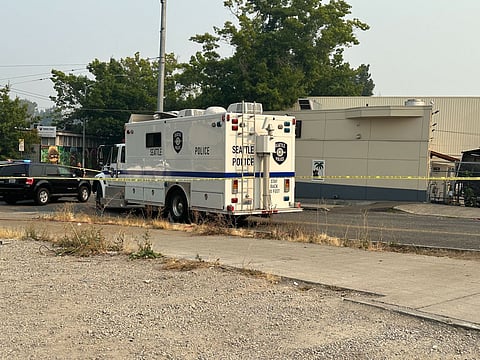 Police vehicles process a mass shooting crime scene on Sunday, Aug. 20, at the Rainier Hookah Lounge. (Photo: Phil Manzano)