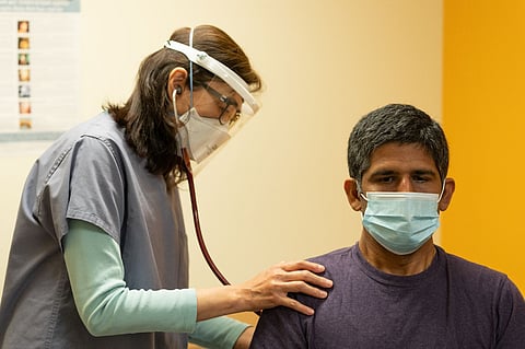 Winnie Lee, PA-C, assistant medical director at ICHS, reviews a patient's vital signs at ICHS' Bellevue Medical & Dental clinic in the Crossroads Neighborhood of Bellevue. (Photo courtesy of ICHS.)