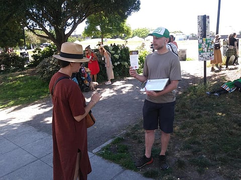 Members of the Seattle chapter of the Democratic Socialists of America (DSA) share information at Cal Anderson Park about the possible UPS strike with interested community members, July 23, 2023. (Photo courtesy of Seattle DSA.)