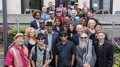 A group photo of some of this year's bands participating in the Jackson Street Jazz Walk, taken at the Langston Hughes Performing Arts Center. (Photo: Lisa Hagen Glynn, courtesy of JSJW)