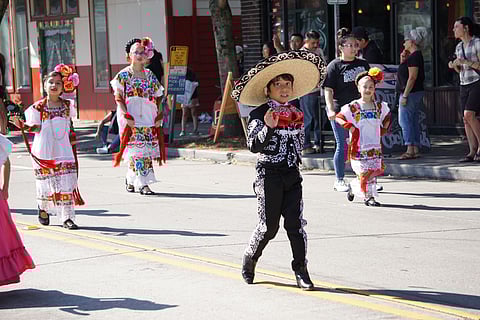 A group of children with dance group Joyas Mestizas. The boy is dressed as a traditional charro and the girls are dressed in the typical Japana attire from Yucatan. (Photo: Agueda Pacheco)
