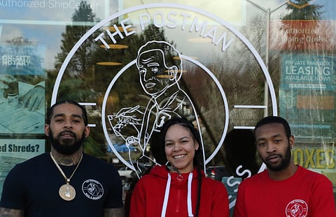 D'vonne Pickett Jr. (right), Keanna Rose Pickett (middle), and Rayjaun Stelly (left) in front of The Postman in 2020.  (Photo: Gavin Amos)
