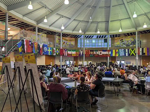 Parents talk at table groups during the Southeast regional "Well-Resourced Schools" engagement meeting at South Shore PK–8 in Rainier Beach. (Photo: Ari Robin Mckenna)