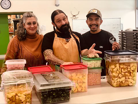 Left to right: Daniella M Nicholas, Chef Jason Vickers of Natoncks Metsu, and Jason Tabasan help prepare a meal at Tilth Alliance's Community Kitchen Meal. (Photo: Jenny Gallucci)