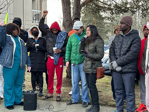Jessica Rojas of International Migrants Alliance tells the group the organization supports their efforts: "And we are here to just show our solidarity, unwaveringly, until you are living in permanent housing and being able to access a dignified life as you're asking for here today." (Photo: Phil Manzano)