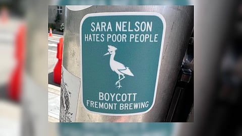 A sticker that reads, "Sara Nelson hates poor people. Boycott Fremont Brewing." in a Seattle neighborhood. (Photo courtesy of Gennette Cordova.)
