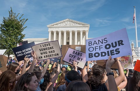 Women's March in Washington, D.C., demanding continued access to abortion in 2021. Photo via Bob Korn/Shutterstock.com