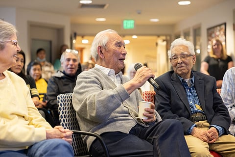 Victor Ikeda adds a comment during the audience share-out portion of the oral history presentation Feb. 16 at The Lakeshore. Susumu Nakanishi, one of the Japanese Americans featured in the presentation, is sitting to his left. (Photo: Alex Garland)