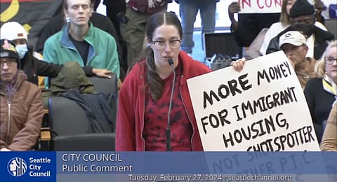 Many who spoke during public comment at the Feb. 27 Seattle City Council meeting advocated for divestment away from policing and new proposed investments in surveillance technologies in favor of support and housing for asylum seekers. Screenshot from the Seattle Channel.
