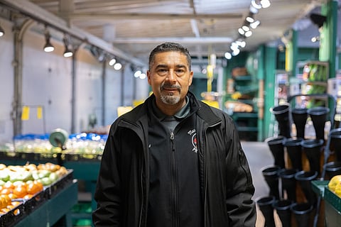 Elias Benitez, a 25-year former employee of Greg MacPherson, is now leasing the produce stand from his former employer, keeping the beloved spot on Beacon Hill. (Photo: Alex Garland)