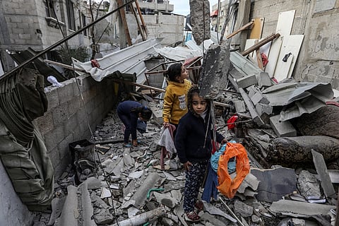 Palestinians inspect their destroyed house after an Israeli air strike in the city of Rafah in the southern Gaza Strip, Jan. 14, 2024. Photo via Anas-Mohammed/Shutterstock.com