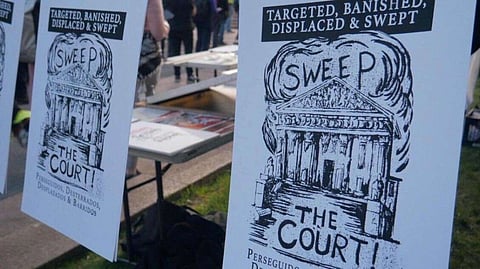 Protesters bear signs protesting an Oregon case that could have widespread effects on how cities address homelessness. (Photo by Jay Jones, courtesy of Services Not Sweeps.)