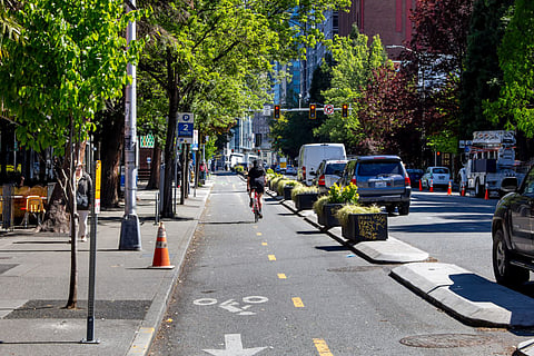 A view of a bike lane adjacent to a downtown Seattle Street in 2019. Photo via The Image Party/Shutterstock.com