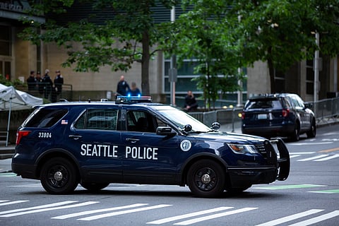 A patrol car in front of the Seattle Police Department West Precinct in 2020. Photo via VDB Photos/Shutterstock.com