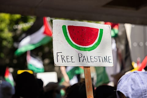A sign with a watermelon and "Free Palestine" is seen at the 76th Anniversary of the Nakba during a rally at Westlake Park. (Photo: Alex Garland)
