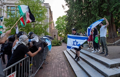 Pro-Israel demonstrators challenge pro-Palestinian protesters Sunday on the University of Washington campus, where an encampment protest has been established calling for UW to divest from companies supporting Israel's war against Hamas. (Photo: Susan Fried)