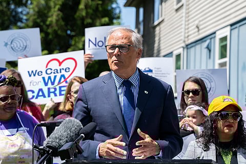 Gov. Jay Inslee and supporters of the WA Cares Fund rally and hold a press conference near Lake Washington Apartments in Rainier Beach. (Photo courtesy of We Care for WA Cares)
