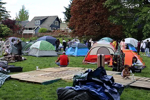 Asylum-seekers hastily erected tents at Powell Barnett Park in the Central District on the afternoon of April 29 after their hotel stay in Kent ran out. At one point, 300 to 400 people were living at the park in tents. (Photo: Guy Oron, courtesy of Real Change)