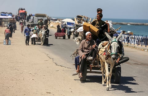 Palestinians fleeing Rafah as Israeli forces launch a ground and air operation in the eastern part of the southern Gaza city, amid the ongoing conflict between Israel and Hamas, in Deir el-Balah in the central Gaza Strip, on May 8, 2024. (Photo by Majdi Fathi/NurPhoto via AP)