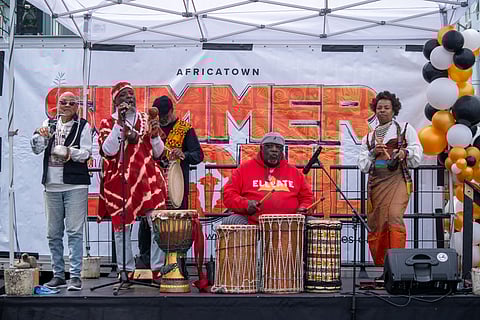 The Mshenga a Babu Rhythm Ensemble performs during the Africatown Community Land Trust's 4th Annual Honoring Our Black Wall Streets on May 27. (Photo: Susan Fried)