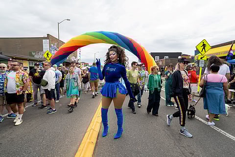 Performer Cherri Bepsi flashes a peace sign at last weekend's White Center Pride. (Photo: Susan Fried)