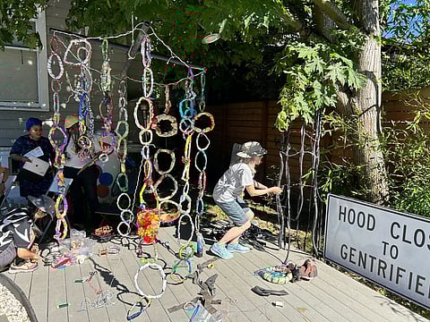 Volunteers assist Marita Dingus in making a new sculpture for Walk the Block later this year. (Photo: Jas Keimig)