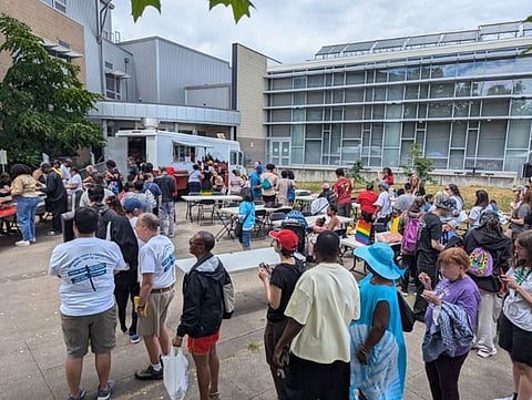 Attendees of the 23rd Annual Atlantic Center Juneteenth Celebration line up to try one of the food vendors serving barbecue and soul food. (Photo: Patheresa Wells)