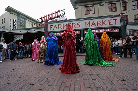 After "The Red Chador" visited Volunteer Park, the chadoras moved to Pike Place Market. (Photo: Bruce Tom)