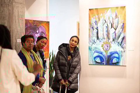 Community members gather to hear an artist talk from Aramis Hamer in the ARTE NOIR gallery space. (Photo by Hilary Northcraft, courtesy of ARTE NOIR.)